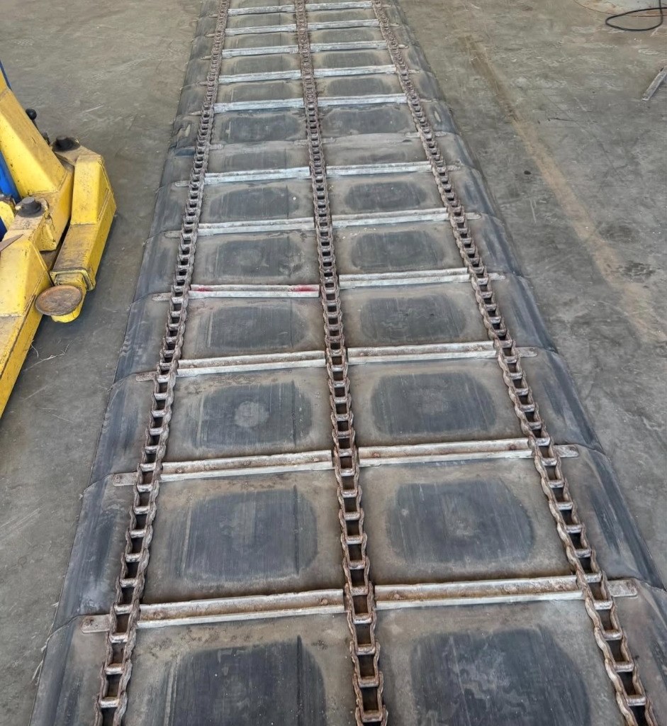 Trailer chain assembly laid out for inspection and rebuilding