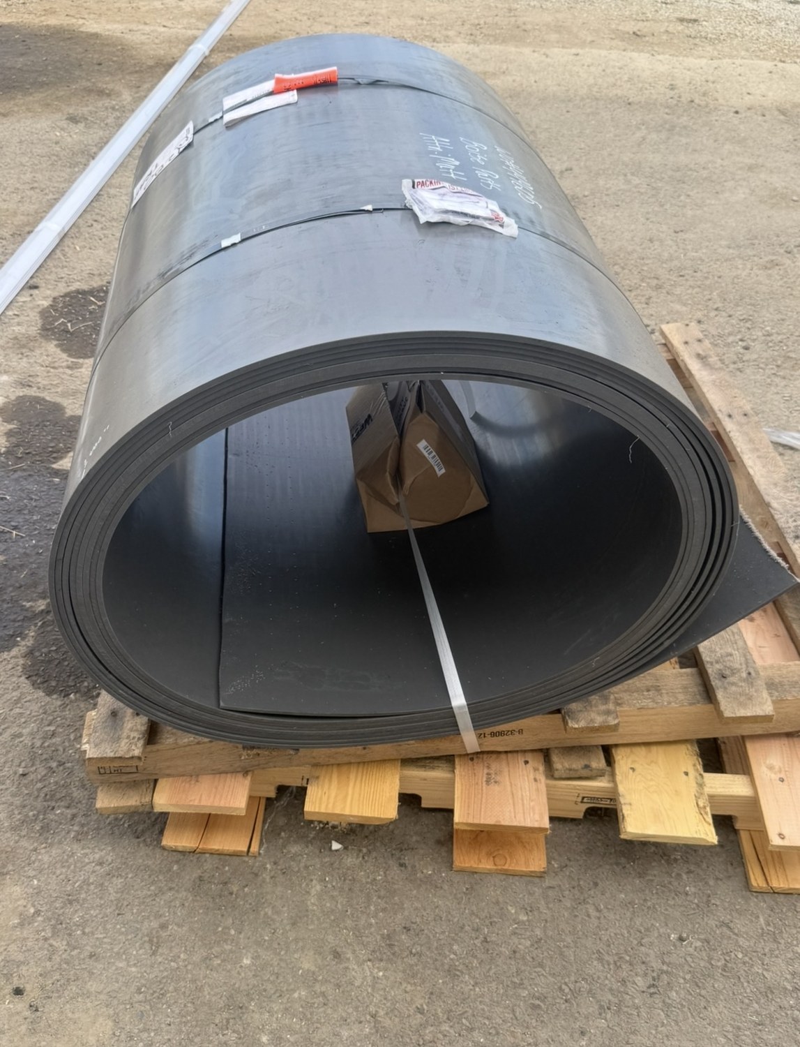 Rolled trailer liner material ready for installation