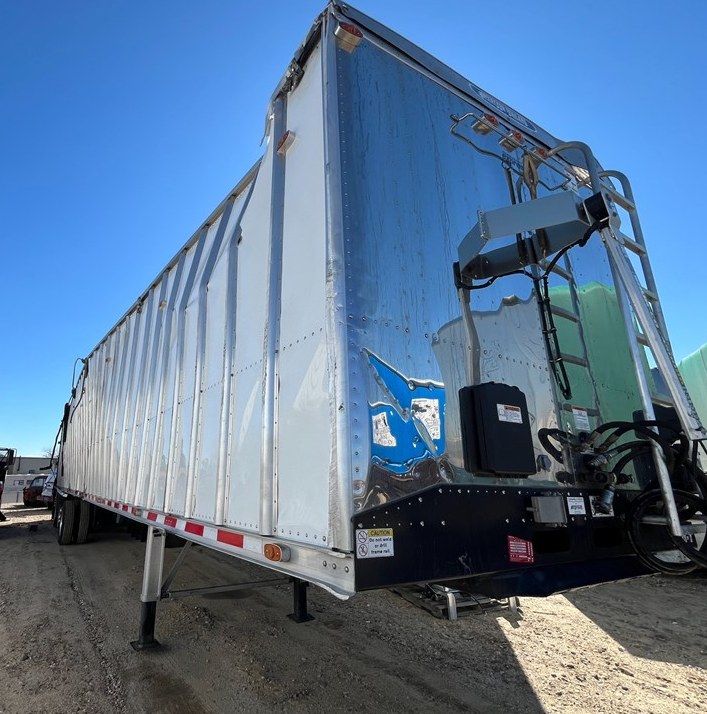 Rear door and unloading components on a tall bulk trailer